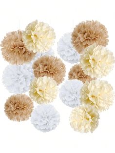 six white and beige tissue pom poms