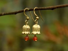 Boho Earrings with Brass flowers and dangle gemstone bead. ＭＡＴＥＲＩＡＬＳ ＡＮＤ ＣＡＲＥ The earrings are made out of brass and a gemstone bead of your choice. . Due to the nature of the materials contact with water should be avoided to avoid changes in color.  ＳＩＺＥ The earrings are 3cm long and 1cm wide. ＳＨＩＰＰＩＮＧ Shipping time 3 work days (usually it's faster than that but sometimes I'm in the middle of nowhere with no access to postal services). All packages will be sent as standard mail unless tracking/ Brass Flowers, In The Middle Of Nowhere, Boho Jewellery, Middle Of Nowhere, Golden Earrings, Earrings Boho, Brass Earrings, Boho Earrings, Boho Jewelry