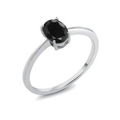 a black diamond ring on a white background with the center stone set in sterling steel