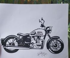 a drawing of a royal enfield motorcycle is shown in black ink on white paper with green foliage behind it