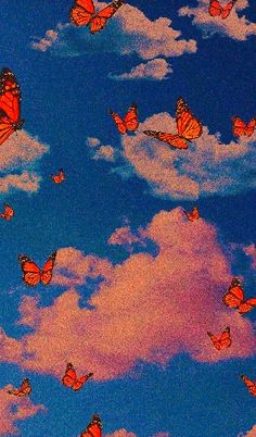 many orange butterflies flying in the blue sky with white clouds and pink sunbeams