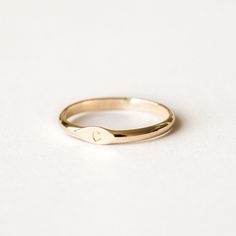 Personalizable and adorable, the Initial Signet Ring is the perfect way to have your loved one with you at all times. You can customize it with your loved one’s initial (or your own!), and wear it 24/7 because it’s gold filled - which makes it tarnish-resistant and waterproof! Its timeless design and perfect size make it the ideal everyday ring. Make it your own and cherish it forever! DETAILS 14k gold filled ring 2mm band Available in sizes 5-8 Safe for sensitive skin & shower safe Bundle & Sav Engraved Gold Ring, T Ring, S Initial, Love Knot Ring, Multiple Rings, Solid Gold Bracelet, Everyday Ring, Diamond Jewelry Necklace, Solid Gold Necklace