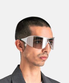 Acne Studios Auggi Shield Sunglasses in Transparent Silver. These shield sunglasses feature a curved peripheral lens, a heart-shaped charm on the side and a logo engraving on the right-side interior arm. Arm Model, Rick Owens Lilies, Product Composition, Lens Logo, Peter Do, Craig Green, Boris Bidjan Saberi, Shield Sunglasses, Mens Eyewear