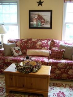 a living room filled with furniture and pillows