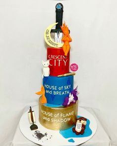 a three tiered cake with different types of items on it