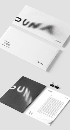 the stationery is designed to look like it has been folded in white and black paper