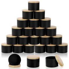 a stack of black containers with wooden lids