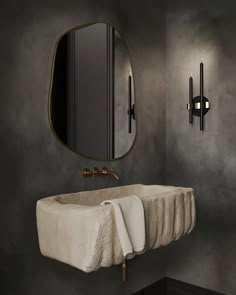 a bathroom with a sink, mirror and towel rack