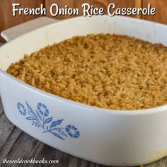 french onion rice casserole in a blue and white dish on a wooden table