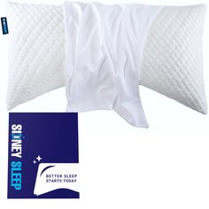 two white pillows with the words sleep on them next to a blue and white package