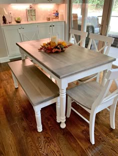 a kitchen table with two benches in front of it