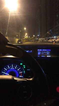 the dashboard of a car at night time