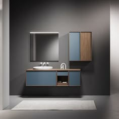 a modern bathroom with grey walls and blue cabinets