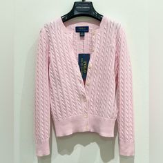 As Iconic As When It Was Introduced Decades Ago, Ralph Lauren's Classic Pink-Knit Cardigan Is A Layering Essential. This Version Features The Signature Embroidered Pony At The Left Chest For A Hint Of Heritage Style. Long Sleeves With Ribbed Cuffs. Ribbed Hem. Buttoned Placket. Imported Crewneck. Signature Embroidered Pony At The Left Chest. Material & Care Machine Washable All Cotton Ralph Lauren Pink Cardigan, Classic Ralph Lauren Winter Cardigan, Classic Ralph Lauren Cardigan For Winter, Classic Pink Cable Knit Sweater, Ralph Lauren Long Sleeve Cotton Cardigan, Ralph Lauren Classic Spring Sweater, Classic Ralph Lauren Sweater For Spring, Classic Pink Knit Sweater, Ralph Lauren Long Sleeve Spring Sweater