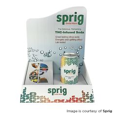 a can of sprig soda sitting on top of a white box with bubbles