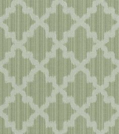 a green and white pattern on fabric