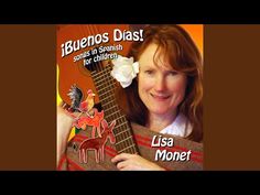 a woman holding up a guitar with the words iguanos dias on it