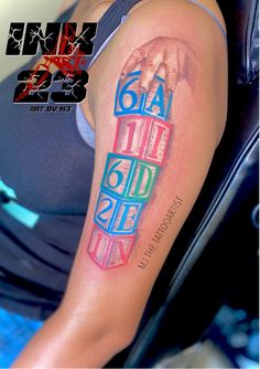 a woman's arm with a colorful tattoo on it, and the word love spelled in