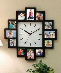 a clock that has pictures on it and is hanging on the wall next to a potted plant