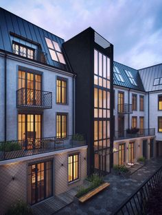 an artist's rendering of the exterior of a two - story apartment building at dusk