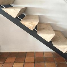 the stairs are made out of wood and metal