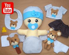 a teddy bear is surrounded by baby items