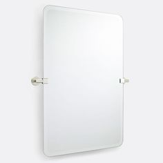 a bathroom mirror mounted to the side of a wall with two handles on both sides