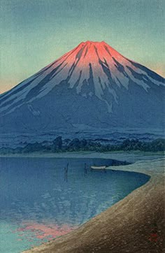 an image of a mountain that is in the distance with water and boats on it