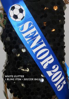 a black and blue ribbon with a soccer ball on it