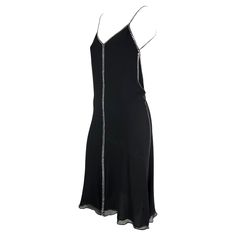 This rare black silk and crystal rhinestone Gucci slip dress was designed by Tom Ford for the Spring/Summer 1999. Natalie Portman wore a light blue variation to the premiere of "The Phantom Menace." Constructed of black silk this slip dress features a v-neckline, spaghetti straps, and a lightly flared hem. This chic little black dress is made complete with square rhinestone accents that line the straps, bust, sides, back and cascade down the front. Approximate measurements: Size - 38IT Bust: 28 1stdibs Dress, Black Tube Dress, Tom Ford For Gucci, Gucci By Tom Ford, Phantom Menace, Black Tube, Gucci Outfits, Black Slip Dress, Pin Up Dresses