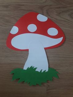 a mushroom cut out on top of a wooden table