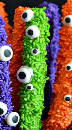 these halloween rice krispy treats are decorated with googly eyes and fake carrots