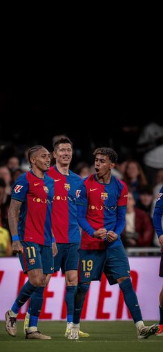 the soccer players are standing together on the field