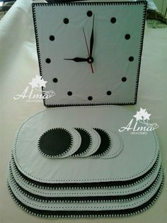 a clock made out of white and black paper