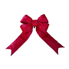 a red bow tied to the side of a white wall