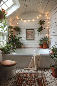 a bathroom with potted plants and lights on the wall