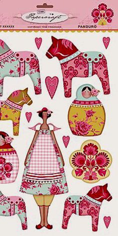 the paper doll is standing next to some pink and yellow decorations with hearts on them