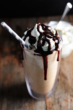 two glasses filled with ice cream and chocolate