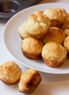 some muffins are on a white plate