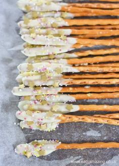 pretzels are lined up and ready to be eaten with sprinkles