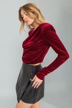 A velvet crop top featuring round neckline, shoulder padded, shirring at shoulder and side, long sleeve and back zipper closure Details Self: 95% Polyester 5% Spandex - Model is 5`8" And Wearing Size Small- Measurements Taken From Size Small- Approx. Length: 18" Fitted Velvet Crop Top, Fitted Velvet Cropped Top, Fitted Cropped Velvet Top, Fitted Velvet Crop Top For Party, Feel Powerful, Velvet Crop Top, Flying Tomato, Chic Top, You Deserve It