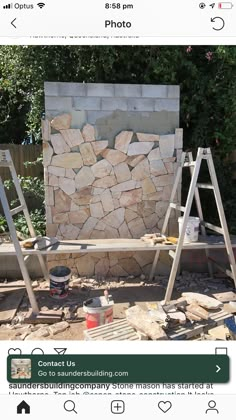 an image of a stone wall being built