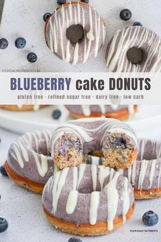 blueberry cake donuts with white glaze and frosting on top are shown