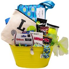 a yellow basket filled with lots of items and a blue ribbon around the bottom half