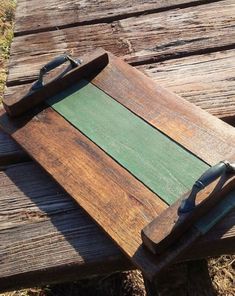 a wooden cutting board sitting on top of a bench