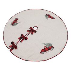 a round table cloth with red and black plaid bows on it, featuring an image of a car