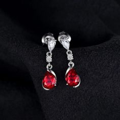 1.9ct Pear Created Red Ruby 925 Sterling Silver Drop Earrings Gemstone Jewelry Specifications - Style: Dangle Drop Stud Earrings - Gem Color: Red - Gem Cut: Water Drop - Material: Solid 925 Sterling Silver - Metal Stamp: S925 - Item Weight: 2.1g - Main Stone: Ruby High-Quality Materials Crafted from solid S925 sterling silver, these small water drop earrings boast strength and shine. They are tarnish-resistant and hypoallergenic, ensuring comfort without irritation. Fit for Any Occasion Enhance