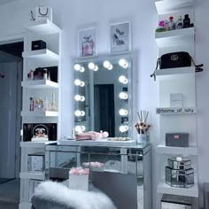 a vanity with lights on it in a room