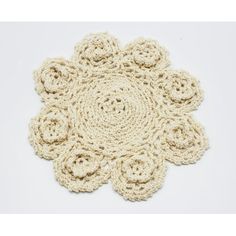 a crocheted doily is shown on a white surface