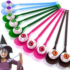 a group of halloween themed spoons with eyes painted on them and witch's hat